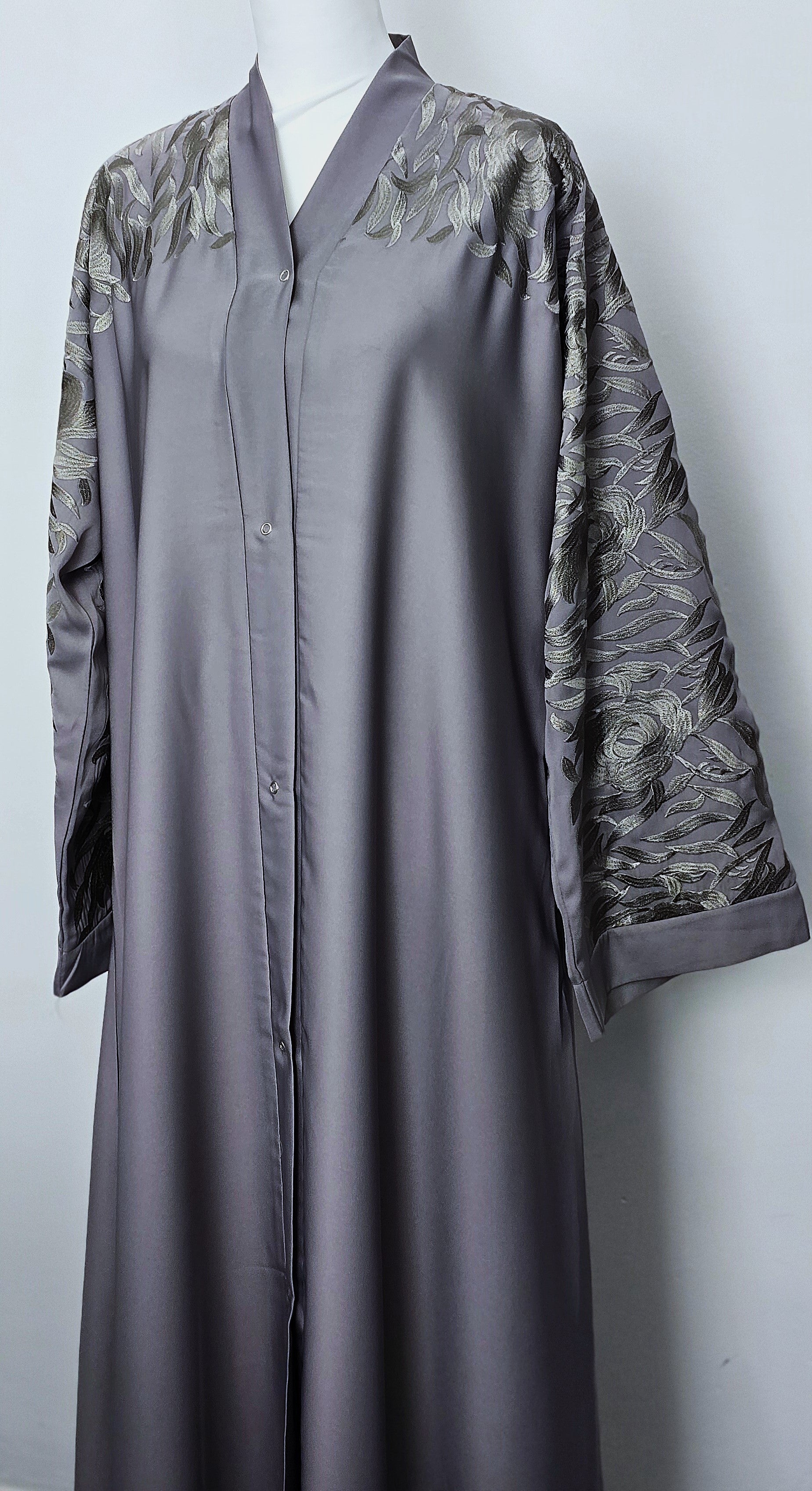 Long grey abaya with floral stitched sleeves. 